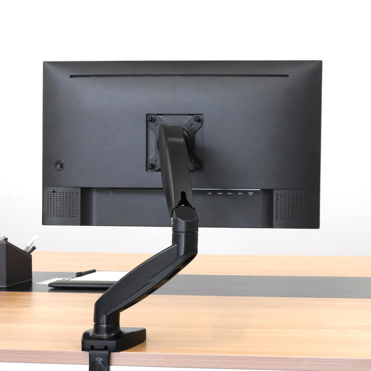 Amazon Basics Gas Spring Monitor Arm for Desk Mounting, Adjustable Tension, for 15–27 inch (38.1cm–68.6cm) Monitors, supports 2.0kg–7.0kg, VESA 75x75/100x100, Black - DS-MADSBE