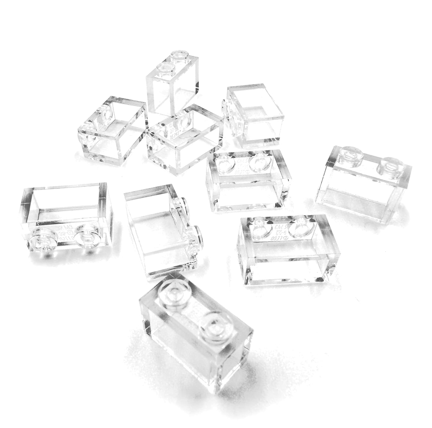10 pieces of LEGO "Stone 1x2 studs" in transparent. - 4806