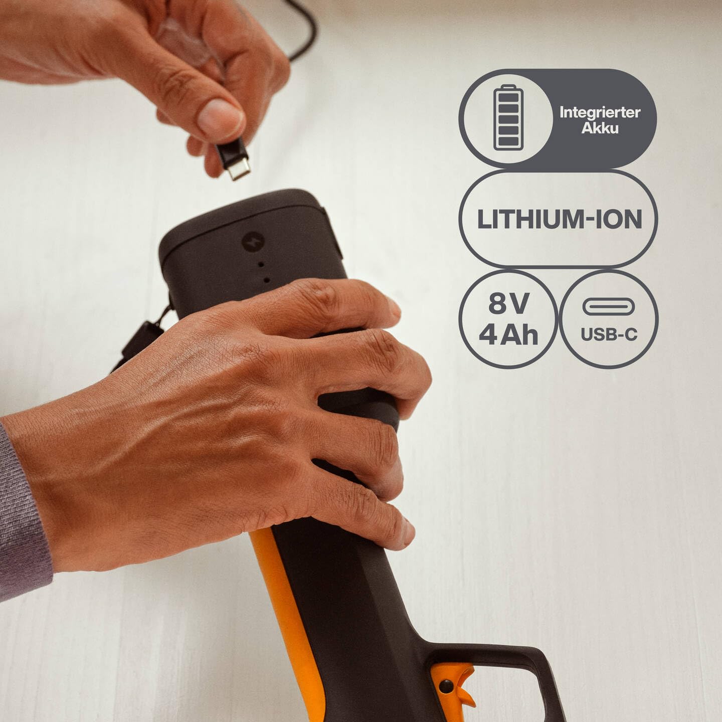 Fiskars cordless secateurs M Bypass, integrated 8V lithium-ion battery, 2 cutting modes, up to 3,500 cuts per charge, for branches up to Ø 25 mm, USB-C charging cable, black/orange, 1082297