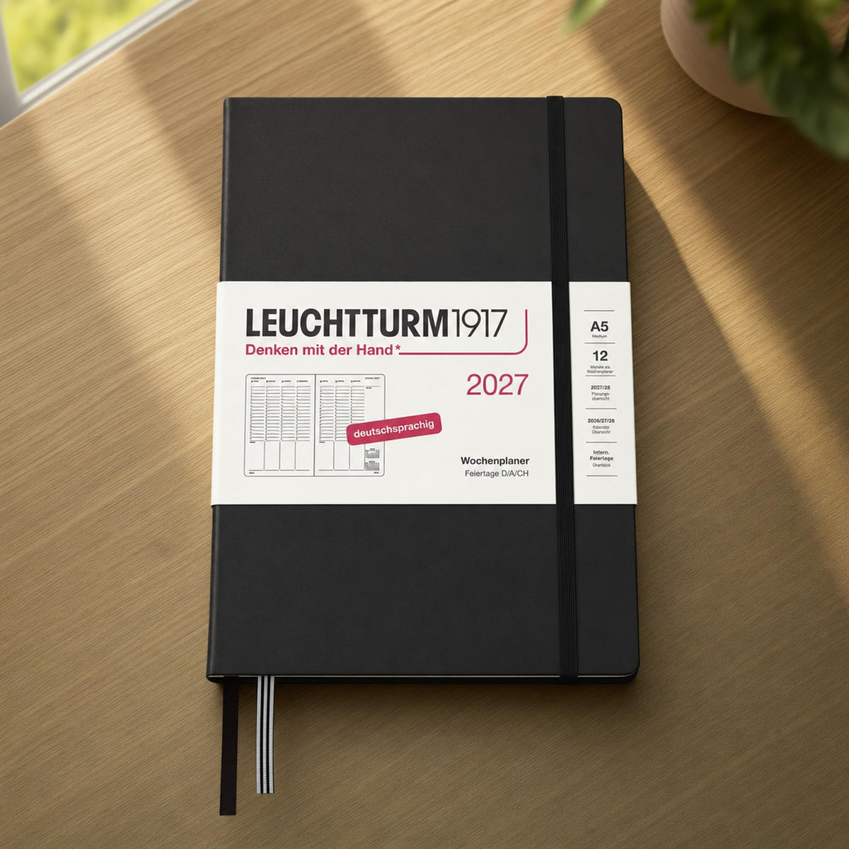 LEUCHTTURM1917 weekly planner 2027 medium (A5) - German, black, 210 x 145 mm, January-December (12 months), weekly overview with hourly grid 7:00-22:00 per column, hardcover, 80 g/m² paper - 400145