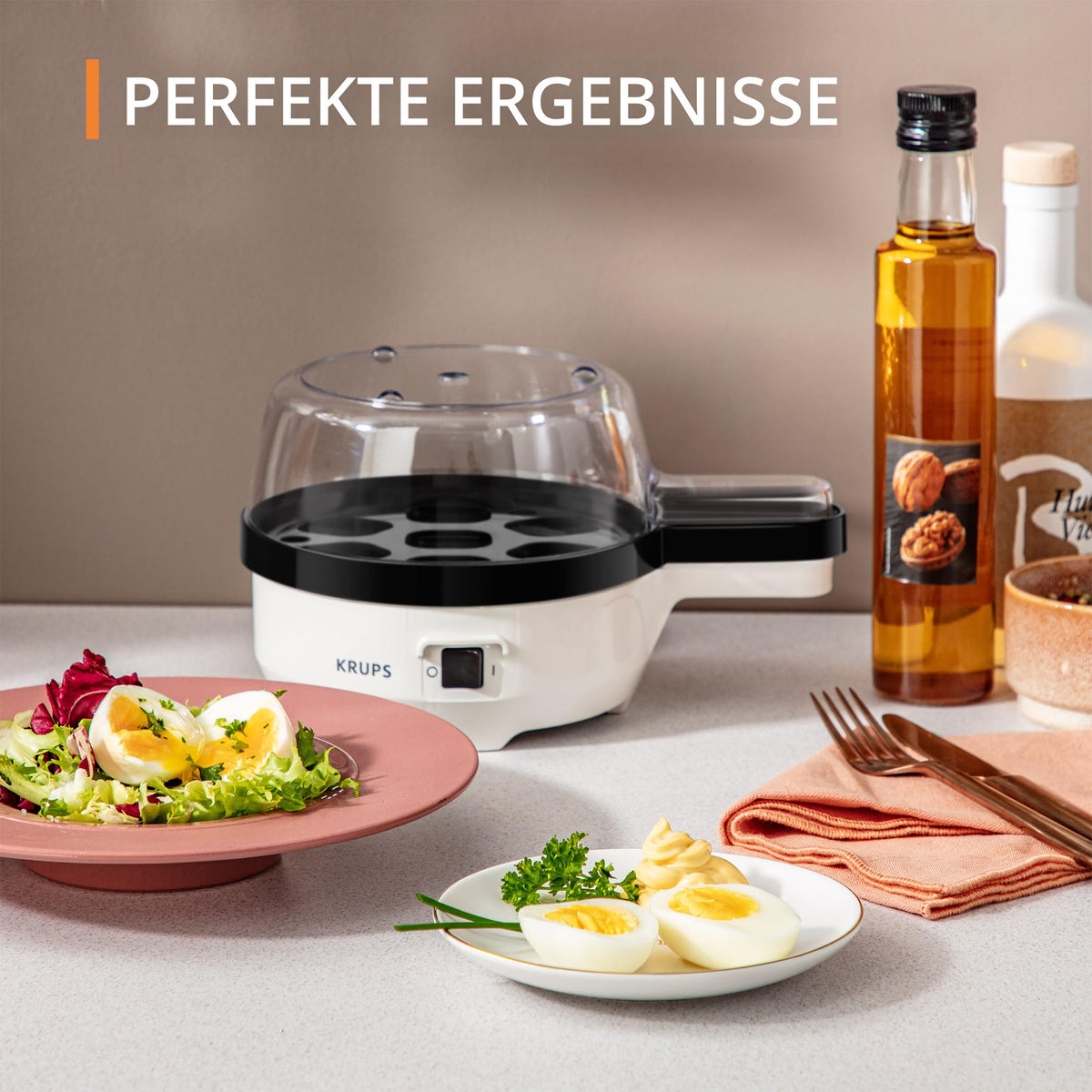 Krups Ovomat Spezial Eierkocher, pentru până la 7 ouă, inclusiv cană de măsurare a apei cu perforator pentru ouă, suport pentru ouă, semnal sonor, EG233115, Alb/Negru